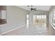 Spacious living area with vaulted ceiling, ceiling fan and tile flooring, adjacent to the eating area at 1104 Auburn Cove Cir, Venice, FL 34292