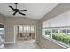 Bright sunroom featuring large windows and neutral color scheme, creating a relaxing atmosphere with a view at 1104 Auburn Cove Cir, Venice, FL 34292