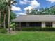 Relaxing screened back patio provides a tranquil outdoor living space with lush landscaping at 114 Southampton N Pl # 237, Venice, FL 34293
