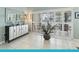 A stylish credenza sits in front of shuttered sliding doors, adding charm to the living space at 114 Southampton N Pl # 237, Venice, FL 34293