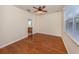 Bedroom featuring beautiful wood floors with a connecting bathroom view at 11649 Tempest Harbor Loop, Venice, FL 34292