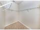 Walk-in closet featuring vinyl tile floor and adjustable shelving at 11649 Tempest Harbor Loop, Venice, FL 34292