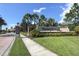 Community entrance featuring the Stoneybrook sign, landscaping and paver sidewalks at 11649 Tempest Harbor Loop, Venice, FL 34292