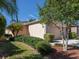 Charming home with a two-car garage, well-manicured lawn, and palm trees at 11649 Tempest Harbor Loop, Venice, FL 34292