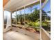 View from a screened patio overlooking a garden with palm trees at 11649 Tempest Harbor Loop, Venice, FL 34292