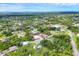 Beautiful aerial view of a wooded lot with other residential homes nearby at 1214 Rumson Ct, North Port, FL 34288
