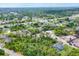 Wonderful aerial view of a wooded neighborhood and a single Gathering home lot at 1214 Rumson Ct, North Port, FL 34288