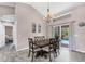 Dining area with sliding door leading to a screened in pool at 1214 Rumson Ct, North Port, FL 34288