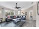 Open living space with hardwood floors, large window views, and elegant furnishings creates a warm, inviting atmosphere at 1214 Rumson Ct, North Port, FL 34288