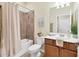 Well-maintained bathroom features a shower over bath and modern vanity at 12370 Canavese Ln, Venice, FL 34293