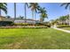 Welcome to Gran Paradiso, a beautiful community with lush landscaping and palm trees at 12370 Canavese Ln, Venice, FL 34293