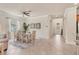 Open dining area with a ceiling fan, natural light, and elegant furnishings at 12370 Canavese Ln, Venice, FL 34293