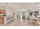 Spacious living room area featuring tile floors, stylish furniture, and an inviting ambiance at 12370 Canavese Ln, Venice, FL 34293