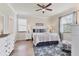 Comfortable main bedroom featuring a ceiling fan, and coastal decor at 12370 Canavese Ln, Venice, FL 34293