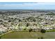 Community aerial view featuring a lake and long range views of the ocean at 1240 Lucaya Ave, Venice, FL 34285