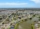 Aerial view of the community, showcasing lakefront property and close proximity to the beach at 1240 Lucaya Ave, Venice, FL 34285
