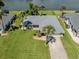 Aerial view of the property showing the lush green lawn and water views at 1240 Lucaya Ave, Venice, FL 34285