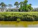 Charming home back yard featuring well-kept lawn and an extended water view at 1240 Lucaya Ave, Venice, FL 34285