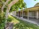 Rear view of screened in patio and landscaping at 1240 Lucaya Ave, Venice, FL 34285