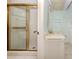 This bathroom features a shower with gold frame and a white vanity at 1240 Lucaya Ave, Venice, FL 34285