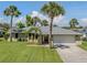 Charming single-story home featuring a well-manicured lawn and a convenient two-car garage at 1240 Lucaya Ave, Venice, FL 34285