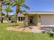 Inviting front entrance featuring a well-maintained lawn and easy access to the two-car garage at 1240 Lucaya Ave, Venice, FL 34285