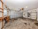 Spacious two car garage featuring storage shelves, work bench, and automatic door at 1240 Lucaya Ave, Venice, FL 34285