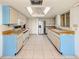 Bright kitchen features white appliances, butcher block countertops, and ample storage space at 1240 Lucaya Ave, Venice, FL 34285