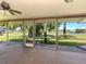 Screened lanai boasts gorgeous waterfront views with a ceiling fan for comfortable outdoor living at 1240 Lucaya Ave, Venice, FL 34285