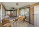 A covered lanai features a seating area and dining space at 1240 Lucaya Ave, Venice, FL 34285