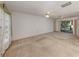 Bright living room with sliding door access to the backyard, creating a seamless indoor-outdoor flow at 1240 Lucaya Ave, Venice, FL 34285
