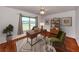 Modern office space features a hardwood floor, cozy rug, comfortable seating and lake views at 1240 Lucaya Ave, Venice, FL 34285