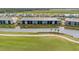 Beautiful aerial view of the condo building backing onto a pond with pristine golf course in the background at 12440 Wellen Golf St # 204, Venice, FL 34293