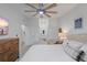 Light and bright bedroom featuring a ceiling fan and a view of the bathroom at 12440 Wellen Golf St # 204, Venice, FL 34293