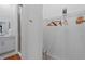 Walk-in closet with shelving and access to the shower at 12440 Wellen Golf St # 204, Venice, FL 34293