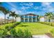 Exterior shot of a clubhouse, featuring a manicured lawn and modern architectural design, perfect for community events at 12440 Wellen Golf St # 204, Venice, FL 34293