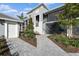 Beautiful townhome exterior with walkway and patio at 12440 Wellen Golf St # 204, Venice, FL 34293