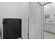 Hallway with closet featuring access to a bathroom with double vanity at 12440 Wellen Golf St # 204, Venice, FL 34293