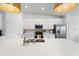 Bright kitchen features stainless steel appliances, white cabinets, and a large center island at 12440 Wellen Golf St # 204, Venice, FL 34293