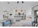 Open-concept living space connects a well-appointed kitchen to a casual living area and dining nook at 12440 Wellen Golf St # 204, Venice, FL 34293