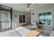 Inviting covered patio boasts a cozy chair, bench seating, and a stylish coffee table for relaxation at 12440 Wellen Golf St # 204, Venice, FL 34293
