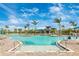 A stunning zero-entry pool with ample lounge seating, perfect for relaxation and recreation on sunny days at 12440 Wellen Golf St # 204, Venice, FL 34293