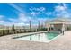 Community pool with an accessible lift, promoting inclusivity and outdoor enjoyment in a relaxing setting at 12440 Wellen Golf St # 204, Venice, FL 34293