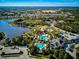 Aerial shot of community featuring swimming pool, clubhouse and surrounding residences at 12689 Sagewood Dr, Venice, FL 34293