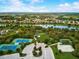 Aerial view showing tennis courts, dog park, and sand volleyball court at 12689 Sagewood Dr, Venice, FL 34293