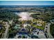 Aerial shows community amenities, pool, playground and expansive parking area at 12689 Sagewood Dr, Venice, FL 34293