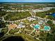 Aerial view shows community amenities including pool, clubhouse, and playground at 12689 Sagewood Dr, Venice, FL 34293