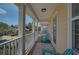 Inviting balcony with outdoor seating, perfect for enjoying the neighborhood views and relaxing outdoors at 12689 Sagewood Dr, Venice, FL 34293