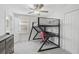 Modern bedroom with a stylish loft bed and a functional workspace underneath, perfect for a student at 12689 Sagewood Dr, Venice, FL 34293