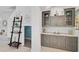 Butler's pantry or bar area with cabinetry, countertop space, and a ladder shelf decor at 12689 Sagewood Dr, Venice, FL 34293
